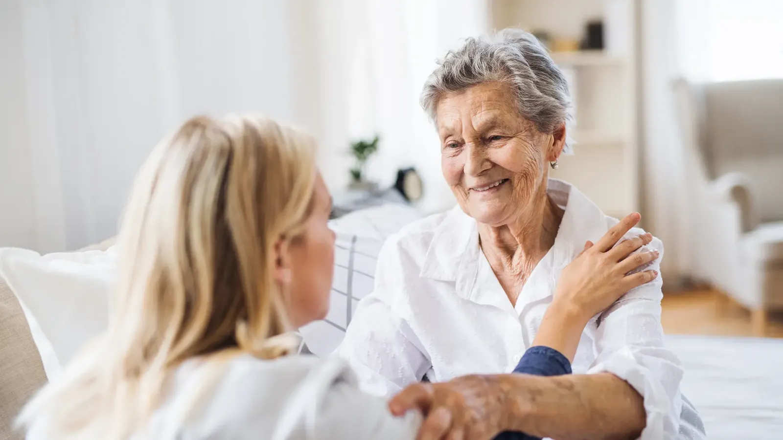 caring woman with elderly customer