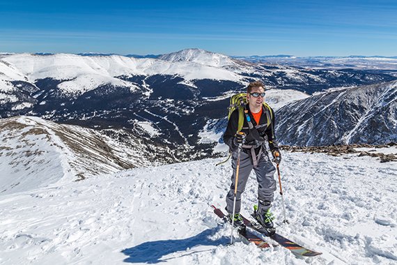 person skiing at the top of a Colorado Mountain
